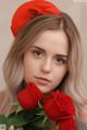 A woman in a red hat holding a bunch of red roses.